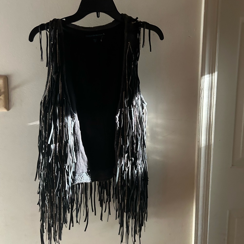 Incredibly cool fringe vest with leather, knit, and chain details